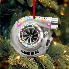 a car engine ornament hanging from a christmas tree