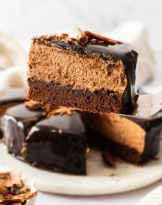 there is a piece of chocolate cake on the plate with it's cut in half