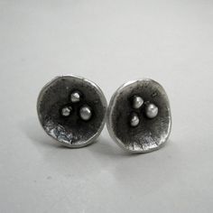 Really beautiful sterling silver ear studs, ► MEASUREMENTS AND DESCRIPTIONS: Made out of 925 sterling silver. Oxidized, with modern contemporary design, satin finish. All my products are designed and handmade by me. This is a cast jewellry. I use the lost wax method, first i create the model in red wax and then i use a local foundry to turn it into silver, then i get back the jewellery to finish it. The earrings is stamped on the back side with 925 Measured approx. 10mm ►The earrings in the phot Mother's Day Silver Sterling Flower Earrings, Nature-inspired Silver Sterling Flower Earrings, Nature-inspired Sterling Silver Flower Earrings, Silver Nature-inspired Flower Earrings For Gift, Handmade Silver Flower Earrings For Mother's Day, Mother's Day Silver Handmade Flower Earrings, Nature-inspired Sterling Silver Flower Earrings Nickel Free, Nickel-free Sterling Silver Nature-inspired Flower Earrings, Minimalist Silver Earrings For Mother's Day