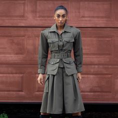 A large military-style jacket with two pockets at chest level and two pockets at waist level. There is a belt at the waist. There is a button on the sleeve. There is a pleat in the center of the back." Cotton Gabardine (65% Cotton, 35% PES) Army Clothes, Mean Women, September Birthstone Jewelry, Army Green Jacket, Military Style Jackets, Gifts For New Mums, Pearl Jewellery Earrings, Military Style, Fashion Jewellery