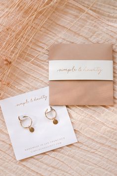 Our Tiny Coin Hoops are perfect, simple earrings that go well with just about everything! They'll add a fun dangle and shine to your look. They're perfect for everyday wear, as they're made of gold fill or sterling silver - materials durable for daily use!  The best part is that they don't tarnish... and they're affordable! Find more at Simple & Dainty. Photo credit: https://www.instagram.com/helloimaubs/ Personalized Yellow Gold Earrings For Everyday Wear, Personalized 14k Gold Earrings For Everyday, Everyday Single Earring In Recycled Gold, Everyday Personalized 14k Gold Earrings, Gold Recycled Gold Huggie Earrings Gift, Dainty Recycled Gold Huggie Earrings, Simple Gold Huggie Jewelry, Dainty Gold Earrings For Everyday, Hypoallergenic 14k Gold Filled Dangle Huggie Earrings