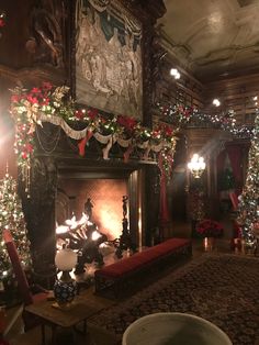 a living room decorated for christmas with fireplace