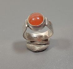 simple sterling silver ring accented with a carnelian cabochon large size cabochon ring size 9.5 usa marked silver anf j & gm the round stone is glued into the setting 20 % restocking fee! Sterling Silver Rings Simple, Carnelian Ring, Cabochon Ring, Ring Sterling Silver, Solitaire Ring, Sterling Ring, Simple Style, Large Size, Silver Ring