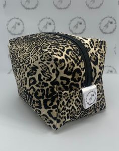 "Introducing our on-trend Leopard Print Makeup Bag, handmade with care in the UK using the finest quality cotton fabric. This bag combines style and practicality, making it a must-have accessory for any makeup lover. What sets this bag apart is its interior lining, which is crafted from an easy wipe PVC fabric. This lining ensures that any spills or mishaps can be easily cleaned, protecting your bag and its contents. With this feature, you can confidently carry your makeup and travel essentials Everyday Gift Pouch Box Bag, Everyday Rectangular Canvas Bag With Zipper Pouch, Daily Use Rectangular Canvas Bag With Zipper Pouch, Eco-friendly Rectangular Cosmetic Bag For Gift, Eco-friendly Rectangular Cosmetic Bag Gift, Rectangular Fabric Bag With Zipper Closure, Eco-friendly Everyday Rectangular Pouch, Canvas Bags With Zipper Pouch For Gifts, Trendy Cotton Bag With Zipper Pouch