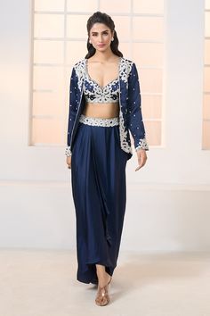 Navy jacket with contrasting hand embroidery. Comes with matching embroidered bustier and embroidered waistband draped dhoti skirt. - Aza Fashions Elegant Blue Sets With Unstitched Blouse, Elegant Royal Blue Saree Set, Elegant Blue Nehru Jacket For Party, Elegant Royal Blue Sets With Zari Work, Fitted Royal Blue Traditional Drape Set, Royal Blue Sets For Party With Traditional Drape, Elegant Royal Blue Festive Sets, Royal Blue Unstitched Sets For Diwali, Traditional Fitted Set With Side Open Design