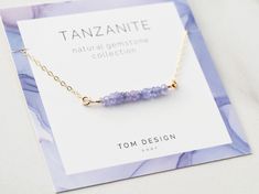 "Tanzanite Bar Necklace / Tanzanite / Gemstone Necklace / Gemstone Bar Necklace / Birthstone Necklace / December Birthday / Tanzanite Gift Our new Gemstone Necklaces are made from natural gemstone beads, with sterling silver, gold filled, or rose gold filled components. Stones are ethically sourced from around the world - we've found the best stones out there! Necklaces are packaged with our custom gemstone cards, then placed into our Tom Design logo stamped gift boxes. Perfect for gift giving! Gemstone Bar Necklace, Permanent Jewelry, December Birthday, Necklace Birthstone, Gemstone Necklaces, Tanzanite Gemstone, Necklace Gemstone, Birthstone Necklace, Custom Necklace