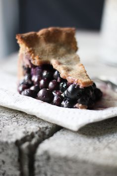 a piece of pie with blueberries on it