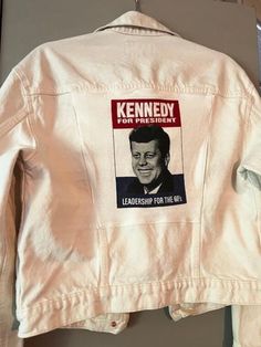 Custom upcycled jean jacket white with applique t shirt JFK on back. Medium Old navy jac. Measures 40" across bust and 36" across waist. Little to no stretch in fabric Upcycle Jeans, Womens Jackets, Jean Jacket, Bleu Marine, Old Navy, Art Collection, Jackets For Women, Bathing Beauties, Purses And Bags