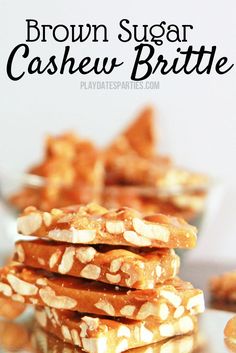 a stack of brown sugar cashew brittles sitting on top of a glass plate