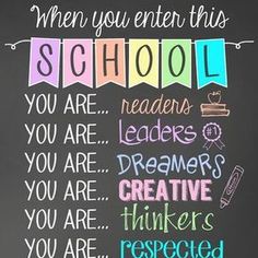 a chalkboard sign that says when you enter this school you are readers, leaders, dreamers, and creative thinkers