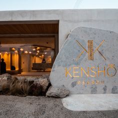 a sign that says kensho in front of a building