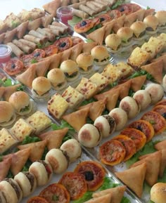 many different types of sandwiches are on display