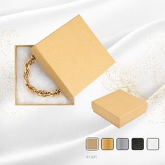 Elegant 3.5" x 3.5" x 1" Cotton-Filled Bracelet Boxes in Gold, Silver, White Swirl, Black Swirl, and Kraft finishes. Sleek design with secure cotton-filled interior, perfect for organizing and displaying bracelets. Available in packs of 24, 48, and 96. Jewelry Cases, Bracelet Box, Delicate Jewelry, Jewelry Case, Jewelry Organization, Sleek Design, Swirl, Jewelry Box, Sleek