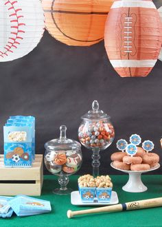 a table topped with lots of food and candy