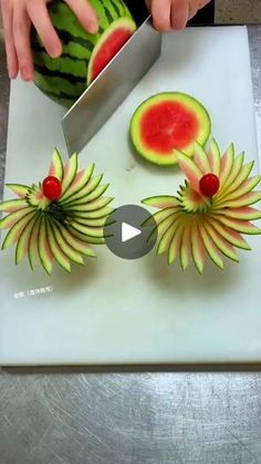 someone cutting up watermelon with a knife on top of a white board next to another piece of fruit