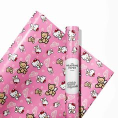 a pink wrapping paper with hello kitty on it