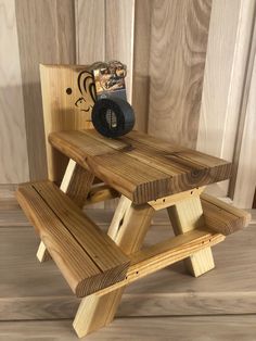 a wooden picnic table with two benches on it