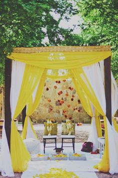 a yellow and white wedding set up