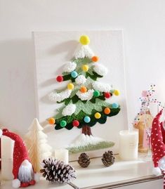 a decorated christmas tree sitting on top of a mantle