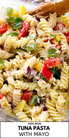 pasta salad in a glass bowl with a wooden spoon on the side and text overlay that reads pasta recipe tuna pasta with mayo