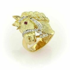 This is a impressive and detailed designed horse head ring, it is crafted from solid 18k yellow and white gold with a polished textured finish. The horse harness is in white gold and is adorned with round cut sparkling diamonds, and a 4 points ruby as its eye. The craftsman did a wonderful job on the face of the horse, it is just adorable. A great equestrian piece, add it now to your fine collection. Material: 18k yellow gold Hallmark: 18k Measurement: 23mm across x 25mm wide x 8mm high from the Diamond Ring Cuts, Horse Ring, Horse Harness, Beautiful Rings Vintage, Gold Horse, Head Ring, Horse Jewelry, Gold Cocktail Ring, Etsy Gold Ring