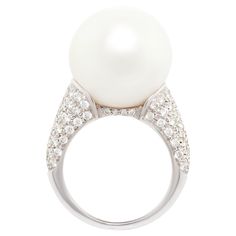 The South Sea pearl and diamond cocktail ring features a large beautiful pearl of 16.2mm diameter. The pearl is perched on top of a gold design with 2.20 carats of round diamonds set en pavé. All of our pearls are untreated: their natural color and high luster have not been enhanced in any way. All of our diamonds are of top quality (F/G-VVS). The ring is one-of-a-kind. It were handmade in Italy in our own workshop by gran maestro Pasquale according to an original design by Ella Gafter. The item Luxury High Luster Pearl Ring For Wedding, Luxury Pearl Drop Ring For Anniversary, Luxury Diamond Pearl Ring With High Luster, Luxury Diamond Ring With Pearl Drop, Cocktail Ring Designs, Diamond Bracelet Design, Round Diamond Setting, Diamond Cocktail Ring, Diamond Cocktail Rings