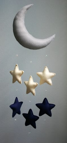 three stars and a crescent hanging from the ceiling