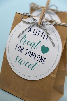 a little treat for someone sweet tag on a brown paper bag with twine around it