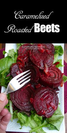 beets on a white plate with lettuce and a fork in the middle