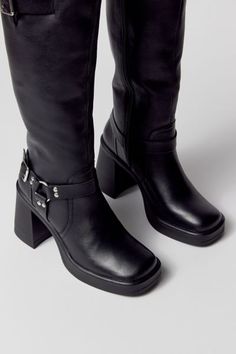 Motorcycle boots from Steve Madden. Tall silhouette in premium leather topped with minimalist moto detailing. Squared toe with a high block heel. Features Steve Madden moto boots Soft leather with moto detailing Zip closure Content + Care Leather, rubber Spot clean Imported Size + Fit Shaft: 13.75" h; 14" circ Heel: 3.5" h | Steve Madden Francine Moto Boot in Black, Women's at Urban Outfitters Motorcycle Boots, Moto Boots, Black Fits, Leather Top, Soft Leather, Steve Madden, Block Heels, Urban Outfitters, Shoe Accessories