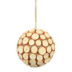 a wooden ornament hanging from a rope with logs on it's side