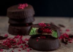 two pieces of chocolate with raspberry filling on top