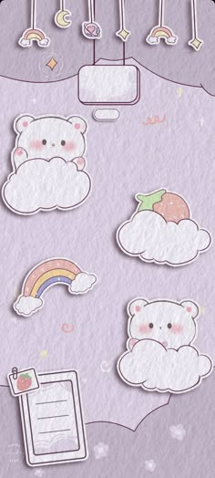 some stickers that are on top of a piece of paper with clouds and rainbows