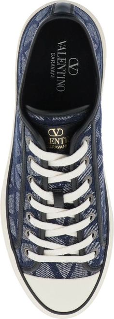 Step up your style game with these denim effect trainers. Made with leather detailing and a screen-printed logo on the tongue, these low-top sneakers are perfect for adding a touch of casual cool to any outfit. With a round toe, lace-up fastening, and rubber sole, these trainers are as comfortable as they are stylish. Blue and black denim effect toile iconographe jacquard fabric Leather detailing Screen-printed logo on tongue Round toe Lace-up fastening Rubber sole Denim Sneakers, Leather Detailing, The Tongue, Black Trainers, Versace Bags, Sneaker Games, Jacquard Pattern, Jacquard Fabric, Fendi Bags