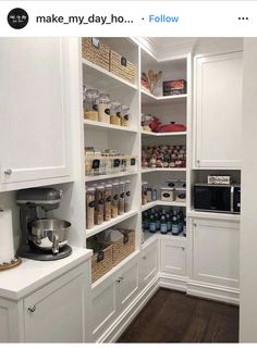 a pantry with white cabinets and shelves filled with food, condiments and other items