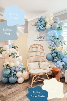 a room filled with balloons and furniture in blue, white and grey colors on the walls