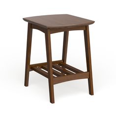 a small wooden table sitting on top of a white floor