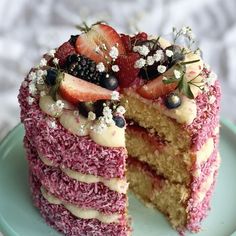 a cake that has been cut into pieces and is sitting on a plate with one slice taken out