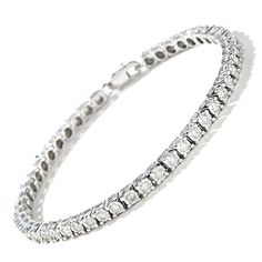 Illuminate her wrist with the lavish look of this stunning 1-1/2 ct. t.w. diamond sterling silver tennis bracelet. Crafted in sterling silver Shimmering diamonds - each artfully set to enhance size and sparkle - line this classic design. Look great solo or layered with other bracelets Captivating with 1-1/2 cts. t.w. of diamonds This 7.0-inch bracelet secures with a lobster claw clasp. Diamond White Tennis Bracelet With Pave Setting, Classic Pave Setting Tennis Bracelet, Classic Diamond Tennis Bracelet With Pave Setting, Classic White Tennis Bracelet With Pave Setting, Platinum Tennis Bracelet With Pave Setting For Formal Occasions, Diamond Tennis Bracelet With Pave Setting, White Gold Diamond Tennis Bracelet With Pave Setting, Diamond Tennis Bracelet With Pave Setting In White Gold, Platinum Tennis Bracelet With Pave Setting