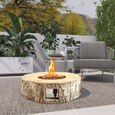 a fire pit sitting in the middle of a patio next to a couch and chair