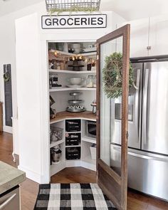 an open pantry in the middle of a kitchen