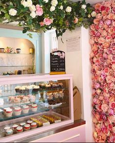 a display case filled with lots of cupcakes