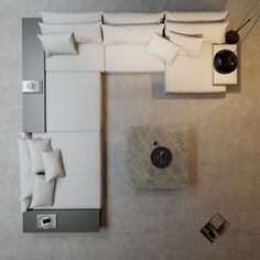 an overhead view of a living room with white furniture