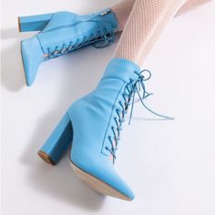 Azalea Wang Chunky Heel Bootie In Blue Is An Exclusive Pair Of Pointed Toe Ankle Booties Featuring A Nylon-Based Upper, Tonal D-Ring Eyelets, A Lace-Up Vamp, And Flared Block Heel. Pointed Toe - Block Heel - Lace Up Vamp 5.75” Shaft Height 4.75” Heel Height Pointed Toe Jean Detail Closet Includes: Pink Boots, Red Boots , Yellow Boots, Silver Boots, Gold Boots, Black Boots, Brown Boots, White Boots, Orange Boots, Tan Boots, Rhinestones Boots, Crystal Boots, Cowboy Boots, Platform Boots, Combat Bo Blue Mettalic Boots, Colbolt Blue Boots, Blue Heart Boots, Royal Blue High Boots, Bloom Winx Club Shoes, Turquoise Platform Boots, Blue Sock Boots, Bluf Boots, Rhinestones Boots