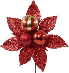 a red and gold christmas ornament on a stick