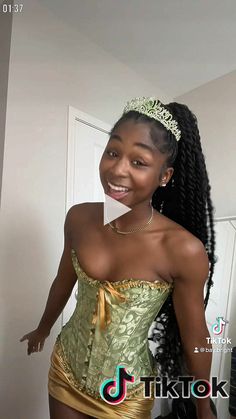 a woman in a gold corset posing for the camera with her hand on her hip