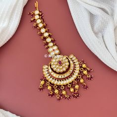 Premium quality oversized kundan mangtika in beautiful ruby red color with heavy pearl details. Inspire your style with this premium quality large mangtika on your wedding day.  All orders Ship same day if placed before 4:00 PM EST  Mangtika Length: 5.4 inch Mangtika Width: 2.5 inch Create beautiful memory for any occasion with elegant jewelry for your loved ones We will be happy to navigate you through the process so if you have any questions regarding our product before placing an order reach Indian Head Jewelry, Punjabi Jewelry, Ruby Red Color, Chain Headpiece, Hair Chains, Wedding Indian, Pearl Details, Head Jewelry, Indian Head