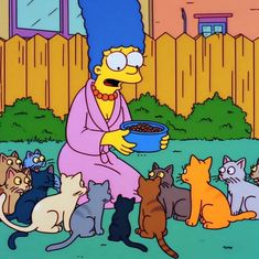 the simpsons is eating out of a bowl with many cats around her in front of him