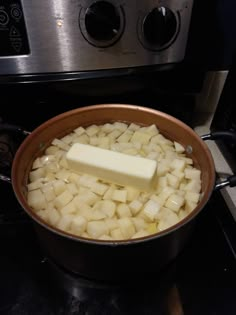 potatoes and butter in a pot on the stove