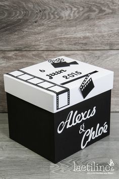 a black and white box with the words alex's & cholo written on it